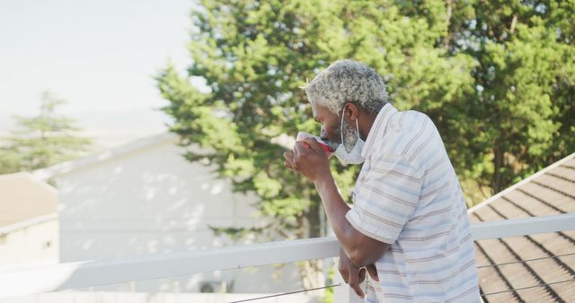 Elderly Man Drinking Coffee on Balcony in the Morning - Download Free Stock Images Pikwizard.com