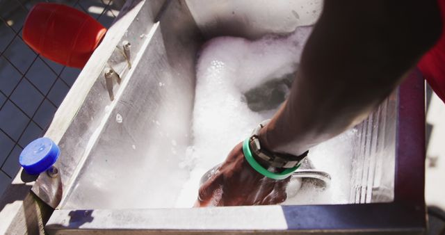 Close Up of Hand Washing Dish in Soapy Water - Download Free Stock Images Pikwizard.com