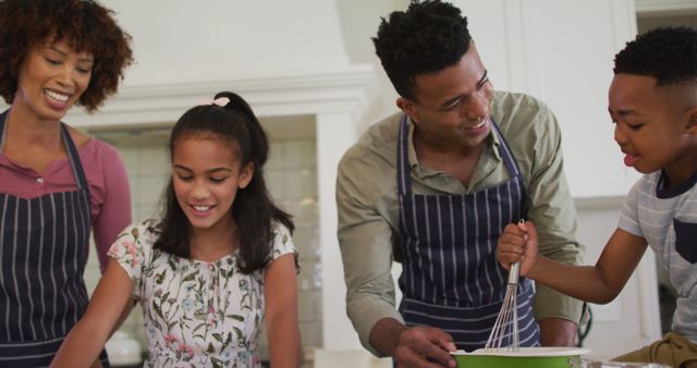 African american family baking together in the kitchen at home. family, love and togetherness concept