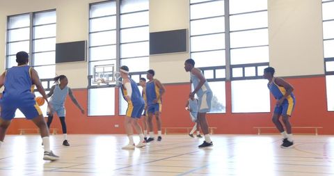 Intense Basketball Game in Modern Indoor Court Setting