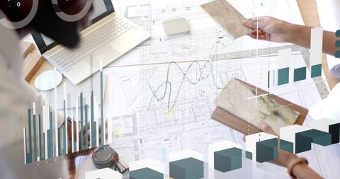 Architects analyzing digital plans with futuristic graphics