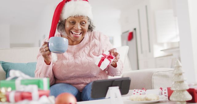 Senior Woman Enjoys Virtual Christmas Celebration with Santa Hat - Download Free Stock Images Pikwizard.com