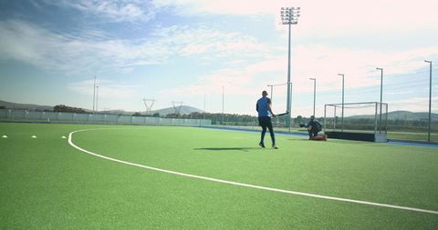 Field Hockey Practice on Sunny Day with Teammates Training