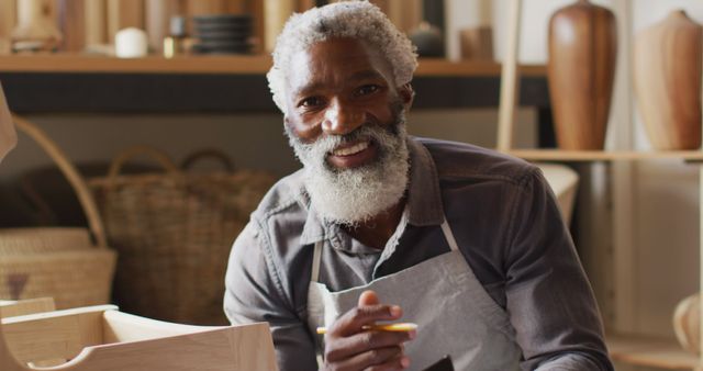 Senior Craftsman Smiling While Working on Wooden Projects - Download Free Stock Images Pikwizard.com