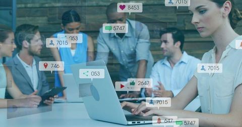 Office team collaborating with digital communication icons overlay