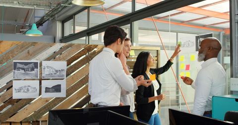 Diverse Team Collaborating in Modern Office With Creative Vibe