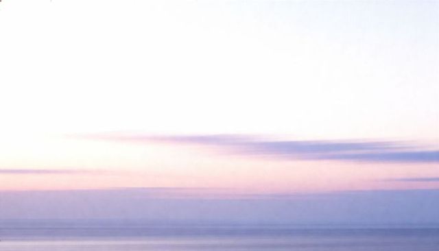 Pastel dawn over calm ocean minimalist seascape soft gradient horizon for backgrounds