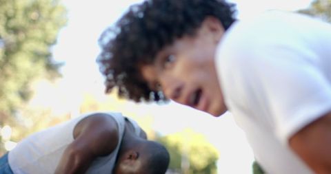 Dynamic exercise in urban park with sporty friends