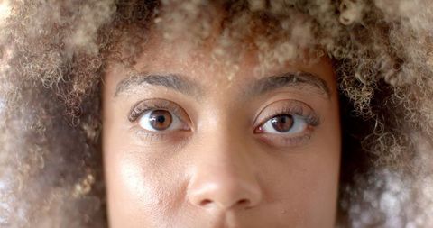 close-up portrait focus on expressive eyes and curly hair - Download Free Stock Images Pikwizard.com
