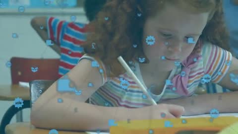 Girl Focused on Writing with Digital Interactive Elements in Classroom