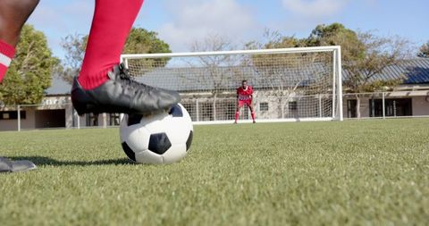 Soccer Striker Preparing to Take Penalty Shot During Match