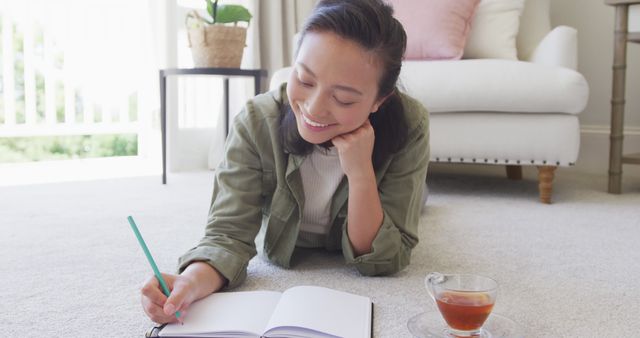 Woman Enjoying Quiet Time Journaling in Cozy Living Room - Download Free Stock Images Pikwizard.com