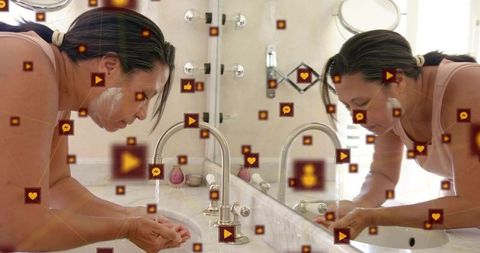 Morning facial cleansing at marble vanity with floating social media icons and mirror reflection