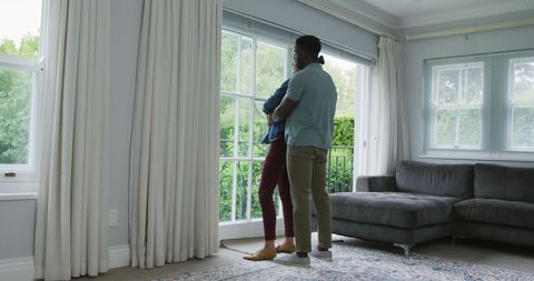 Happy Couple Embracing in Bright Modern Living Room - Download Free Stock Images Pikwizard.com