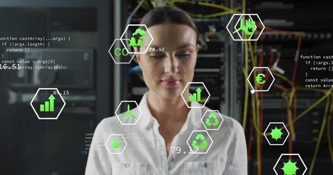 Female it engineer monitoring green data center using hud analytics overlays and servers