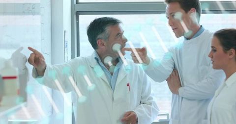 Scientists Collaborating and Sharing Insight in Modern Laboratory