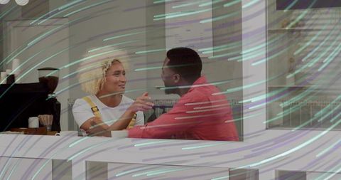 Warm café interaction with diverse couple engaged in conversation