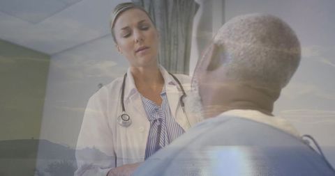 Doctor consulting elder patient with seascape double exposure conveying calm medical care