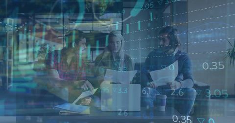 Business team collaborating amid financial data overlay