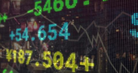 Stock Market Data with Overlay of City Night Traffic Lights