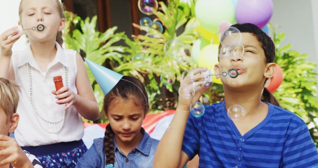 Children Blowing Bubbles at Outdoor Birthday Party - Download Free Stock Images Pikwizard.com