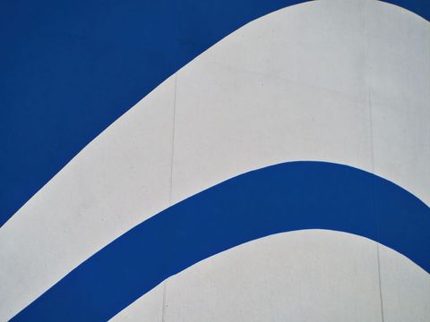 Abstract Minimalist Blue Wave Design on Textured Surface