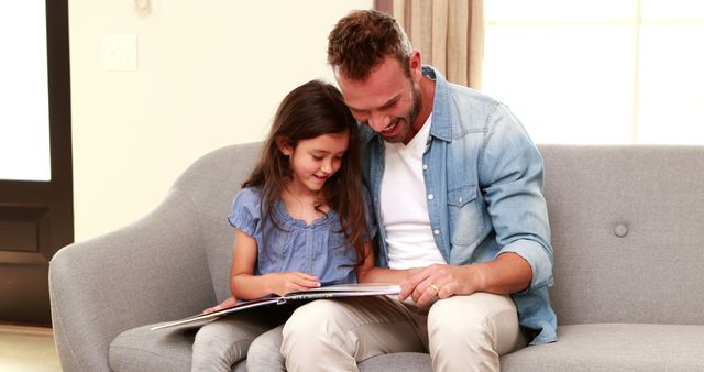 Happy Father and Daughter Reading Together Cozy Bonding Moment - Download Free Stock Images Pikwizard.com