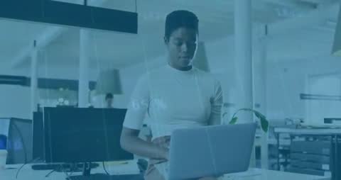 Businesswoman Using Laptop with Data Processing Animation in Office