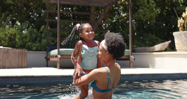 Mother and Daughter Enjoying Pool Time Together - Download Free Stock Images Pikwizard.com