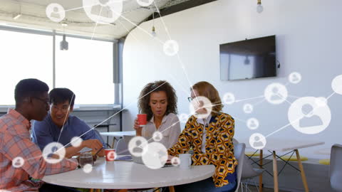 Diverse Team in Modern Office Collaborating with Technology