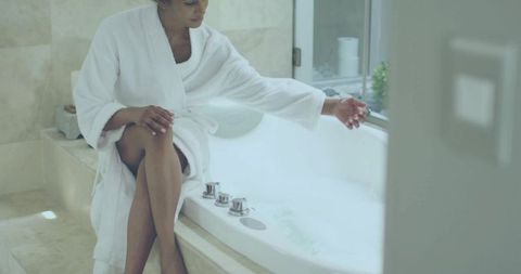 Woman Enjoying Relaxing Bubble Bath at Home in Luxurious Setting
