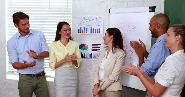 Team Applauding Achievements in Office Presentation - Download Free Stock Images Pikwizard.com