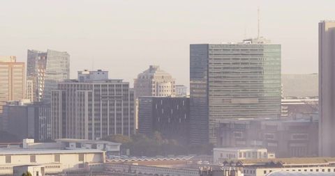 Modern Urban Skyline with Glass-Clad Office Towers at Dusk