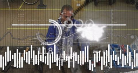 Mature mechanic inspecting parts at workbench with augmented reality HUD and diagnostics