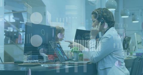 Business Team Collaborating with Digital Financial Data Displays