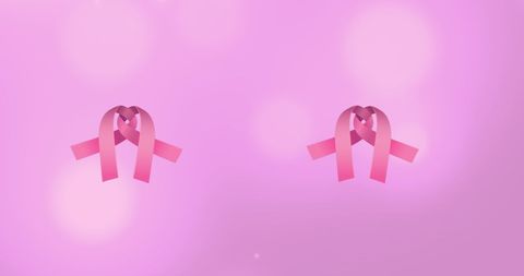 Pink ribbons on subtle pink background promoting awareness
