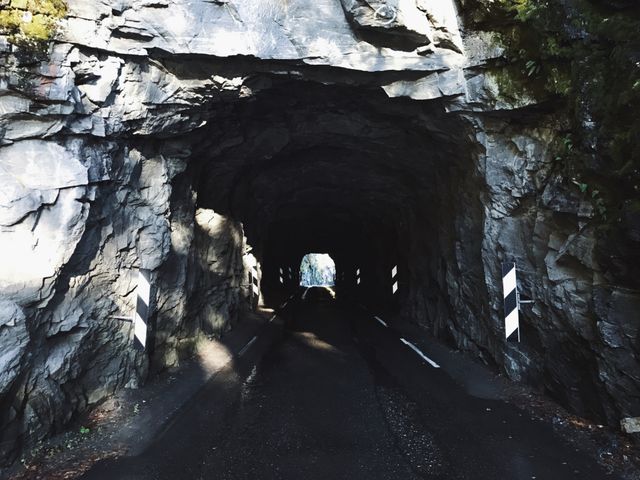Dark Road Tunnel Through Rocky Mountain - Download Free Stock Photos Pikwizard.com