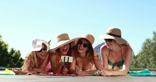 Girlfriends Enjoying Vacation Sunbathing and Taking Selfies - Download Free Stock Images Pikwizard.com