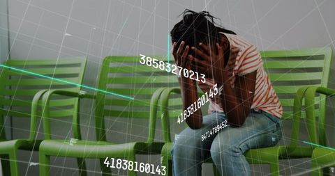 African American Woman Stressed in Waiting Room with Overlayed Data