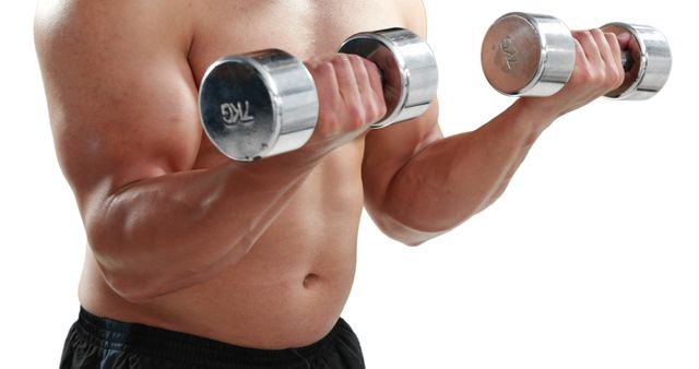 A young Caucasian man is lifting dumbbells, focusing on his bicep workout, with copy space. His muscular physique and the weights emphasize a theme of strength training and fitness.