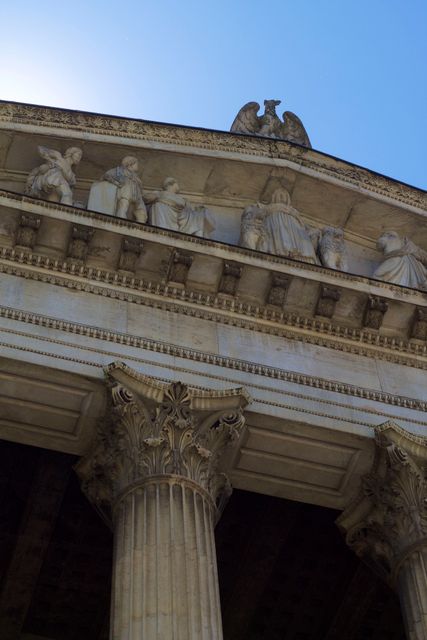 Image features the detailed architecture of an ancient classical building with column structures and ornate carvings. Ideal for use in educational materials, historical presentations, travel brochures, and architectural studies to illustrate classic architectural styles.