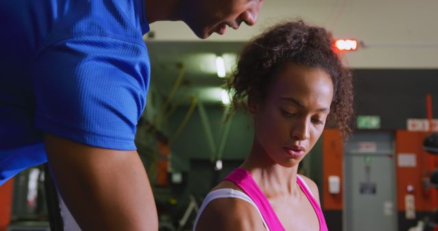 Personal Trainer Assisting Woman with Workout in Gym - Download Free Stock Images Pikwizard.com