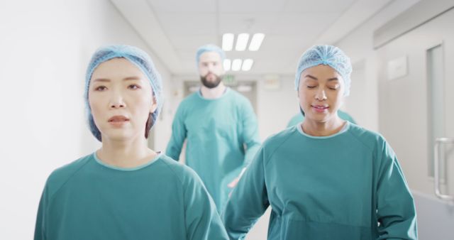 Medical Team Walking Down Hallway in Hospital - Download Free Stock Images Pikwizard.com