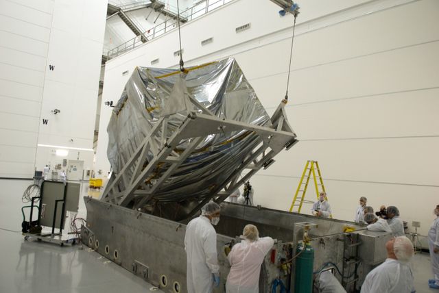 CAPE CANAVERAL, Fla. – At the Astrotech Space Operations facility in Titusville, Fla., NASA's newly arrived GOES-P meteorological satellite is lifted from its transportation case.    GOES-P, the latest Geostationary Operational Environmental Satellite, was developed by NASA for the National Oceanic and Atmospheric Administration, or NOAA.  GOES-P is designed to watch for storm development and observed current weather conditions on Earth.  Launch of GOES-P is targeted for no earlier than Feb. 25, 2010, from Launch Complex 37 aboard a United Launch Alliance Delta IV rocket.  For information on GOES-P, visit http://goespoes.gsfc.nasa.gov/goes/spacecraft/n_p_spacecraft.html. Photo credit: NASA/Glenn Benson