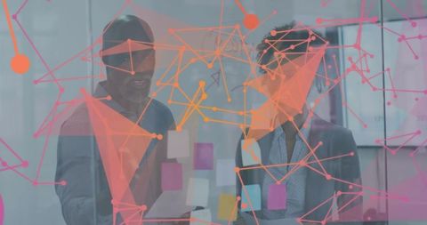 Collaborating at glass wall with sticky notes and data network overlay for team brainstorming