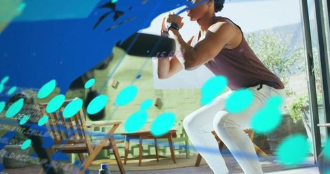 Man Performing Home Squat with Turquoise AR Overlays for Remote Fitness Training
