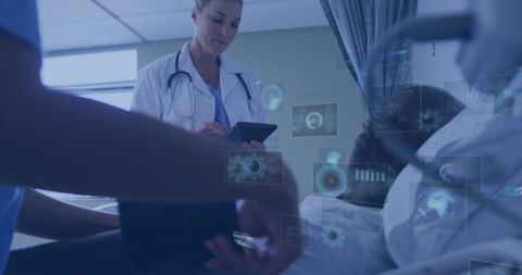 Doctor using digital tablet for patient record management in hospital