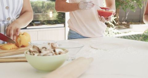 Cooking Together in a Bright Kitchen with Fresh Ingredients