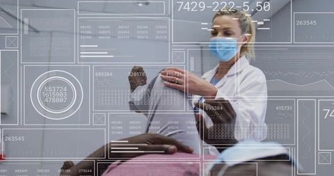 Doctor with Digital Interface Display in Examination Room