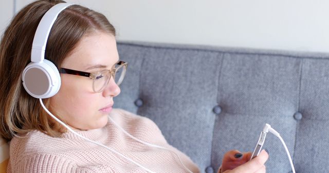 Teen Girl Relaxing with Headphones and Smartphone - Download Free Stock Images Pikwizard.com